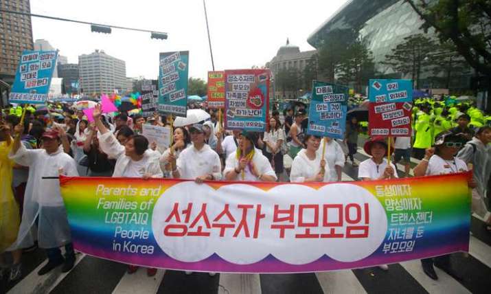 Parents of sexual minorities carry a banner proclaiming themselves “the association of parents of LGBT children.” From koreatimes.co.kr