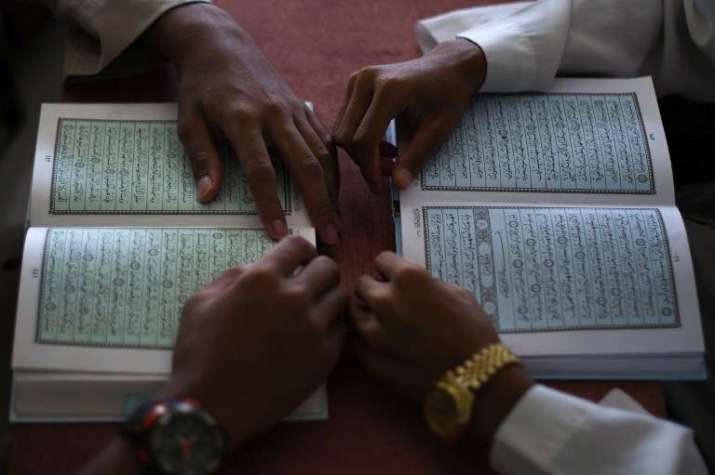 Studying the Qur'an. From themalaymailonline.com