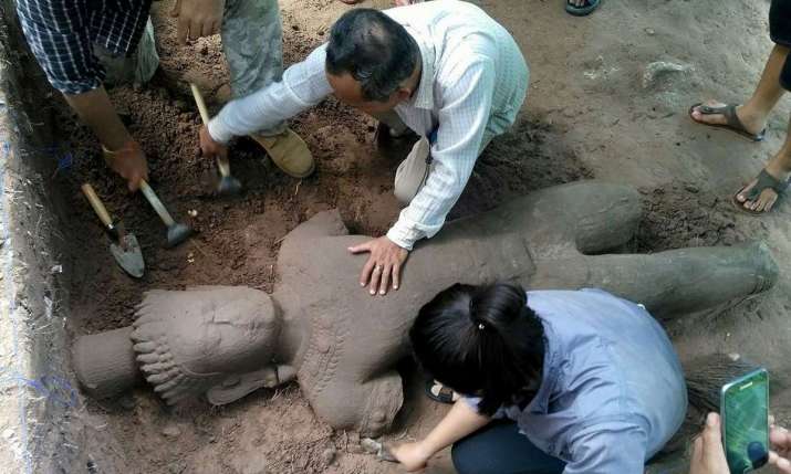 Archaeologists excavate the statue believed to have once stood guard over an ancient hospital. From theguardian.com