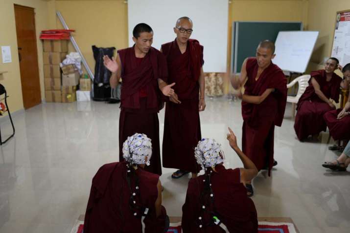 Monks engaged in a debate. From scienceformonks.org