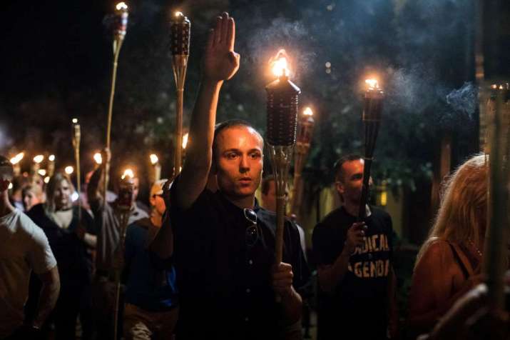 White supremacists march at the University of Virginia. Photo by Edu Bayer. From nytimes.com