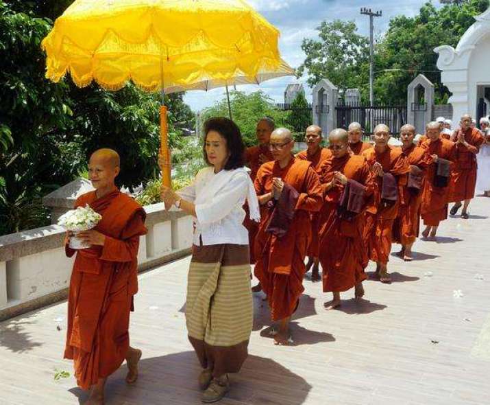 A procession of bhikkhunis at Wat Nirotharam in the northern Thai province of Chiang Mai. Photo by Denis Gray. From asia.nikkei.com
