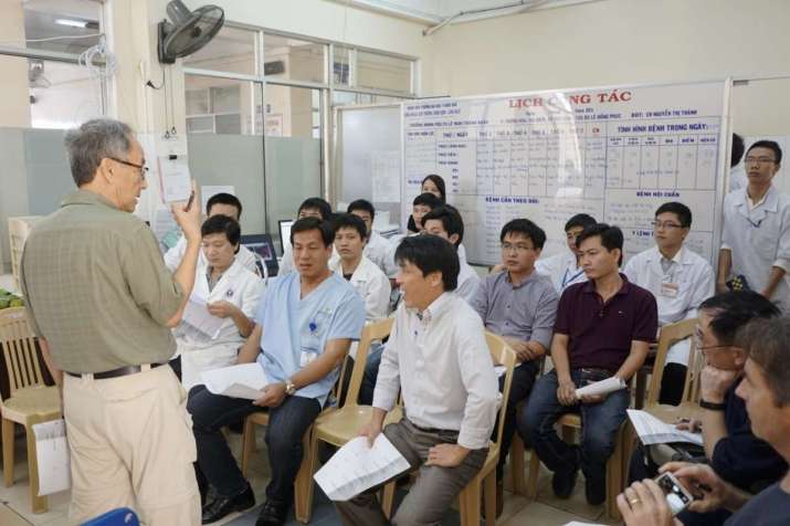Dr. Sum conducting a training session with local doctors