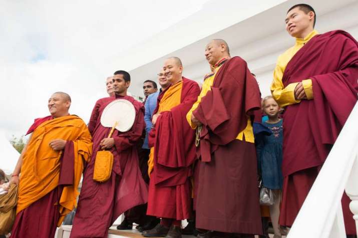 Buddhist teachers with Kundeling Tatsak Rinpoche, center, in front of the stupa. Image courtesy of Baatr U. Kitinov