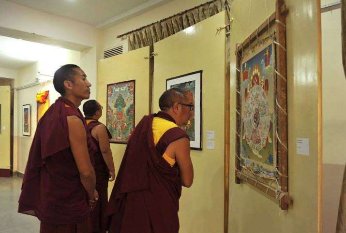 Visitors enjoy the LTWA’s <i>thangkha</i> exhibition. From Library of Tibetan Works and Archives Facebook