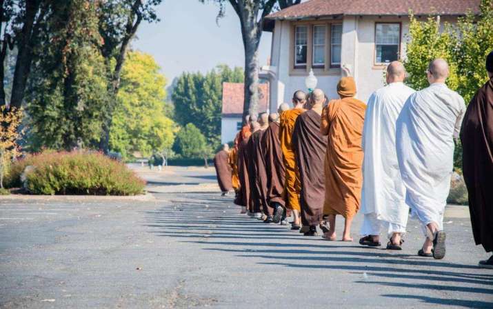 Abhayagiri and CTTB monks walk to lunch together. From drbu.org