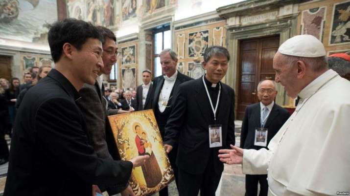 Pope Francis receives a gift from participants at the “Perspectives for a World Free from Nuclear Weapons and for Integral Disarmament” conference at the Vatican. From voanews.com