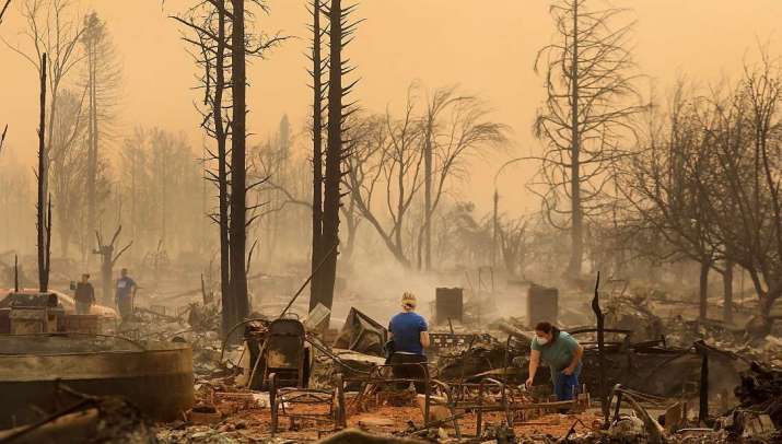 Victims of the Northern California wildfires sift through the remains of their home. From cnn.com