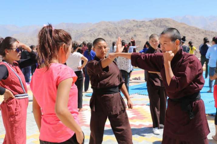 The nuns demonstrate how to throw a punch during a public workshop in August. From Kung Fu Nuns Facebook