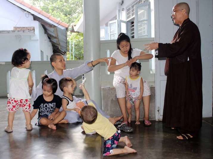 The older children are given responsibilities to care for the younger ones. Image courtesy of Duc Son Orphanage