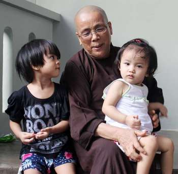 Thich Nu Minh Tu with two of her children. Image courtesy of Duc Son Orphanage