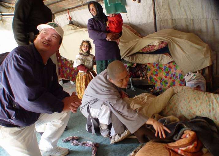 Visiting slums in Jordan in 2004—a mother with a newborn baby. Image courtesy of Dharma Drum Publishing Corp