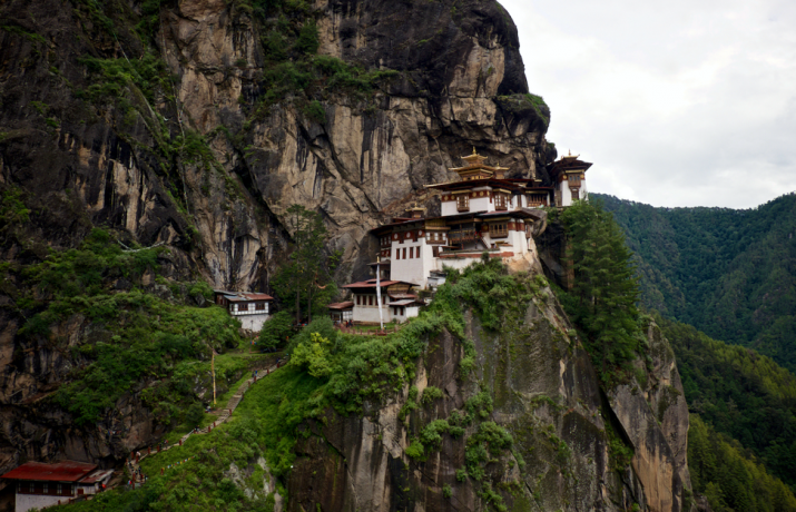 Bhutan's iconic Taktsang Palphug Monastery, also known as the Tiger's Nest. Photo by Craig Lewis. From newlightdreams.com