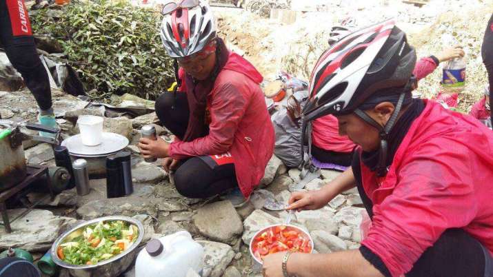 The nuns will often source local vegetarian food, cooking in enclaves along their route. At each stop, they will also clean the area of any litter and plastic waste they find. From Kung Fu Nuns Facebook