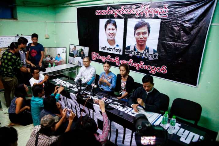 Pan Ei Mon, center left, wife of Wa Lone, and Nyo Nyo Aye, center right, sister of Kyaw Soe Oo at a news conference in Yangon on Thursday. From reuters.com