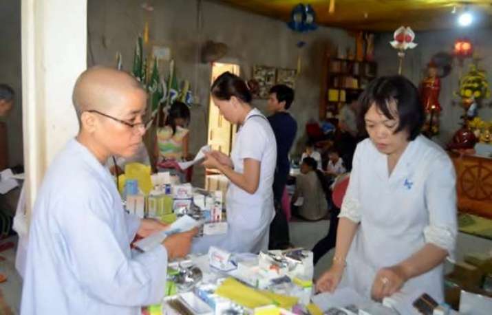 A nun and nurse check pharmaceutical supplies during a medical mission. Image courtesy of TTDHC