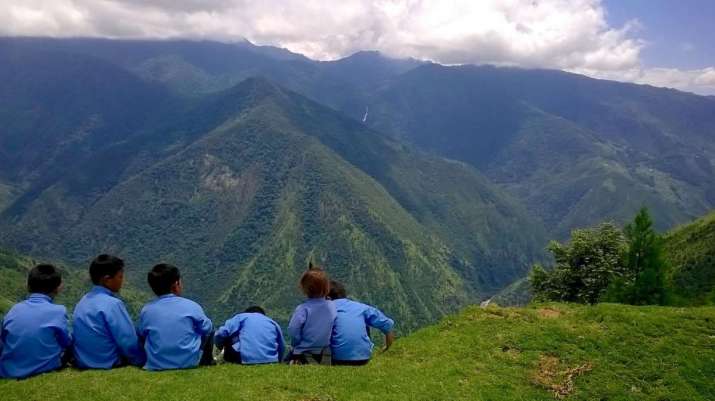 Children sit before a Himalayan vista at Jhamtse Gatsal. Image courtesy of Jhamtse Gatsal