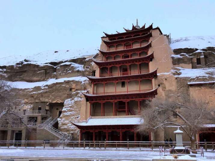 The Mogao Caves at Dunhuang, in winter snow. From en.dha.ac.cn