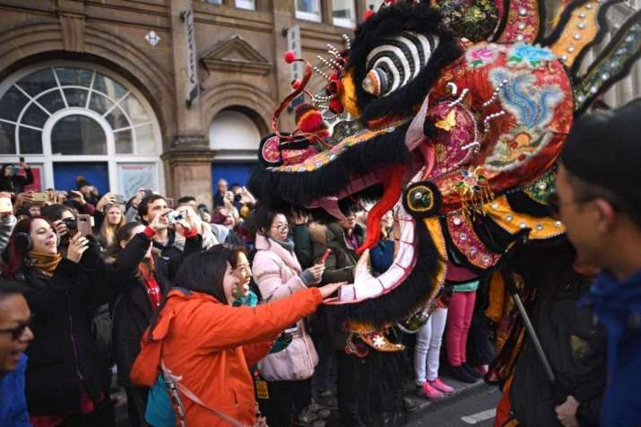 A dragon is paraded though the streets of London as part of the Chinese New Year celebrations. Photo from AFP