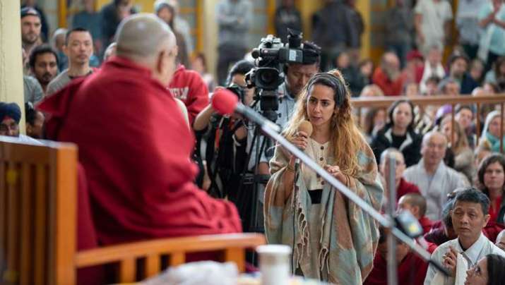 An audience member asks a question during Monday’s meeting. Photo by Tenzin Choejor. From dalailama.com
