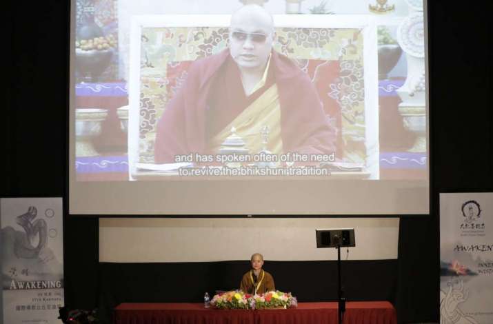 His Holiness the Karmapa addresses the conference by video feed. Image courtesy of the author