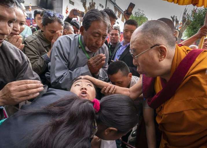 The Dalai Lama comforts a young woman on his way to the Leh Jokhang on Wednesday. Photo by Tenzin Choejor. From dalailama.com