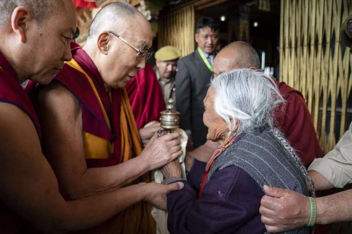The Dalai Lama comforts an elderly women as he departs the Leh Jokhang on Wednesday. Photo by Tenzin Choejor. From dalailama.com