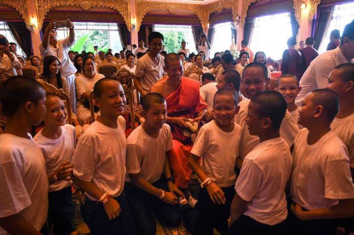 Coach Chanthawong surrounded by the 11 boys after the ceremony. From thenational.ae