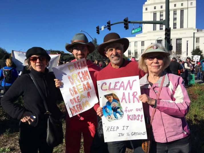 Clair Brown and family joined 60,000 people in Oakland in January 2018, along with hundreds of thousands across the US, to protest against policies of the Trump administration. From buddhisteconomics.net