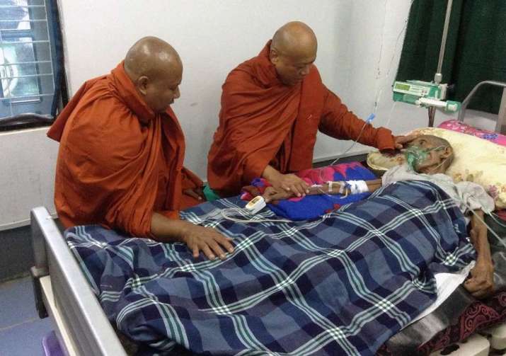 Monks offer blessings and solace to a resident in intensive care. Image courtesy of Twilight Villa