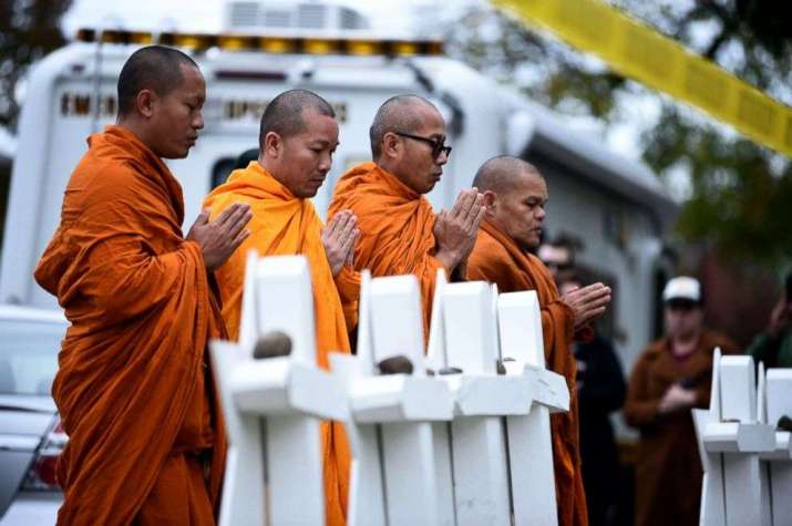 Buddhists pay respect at a memorial outside the Tree of Life synagogue in Pittsburgh after the shooting that left 11 people dead. From abcnews.go.com