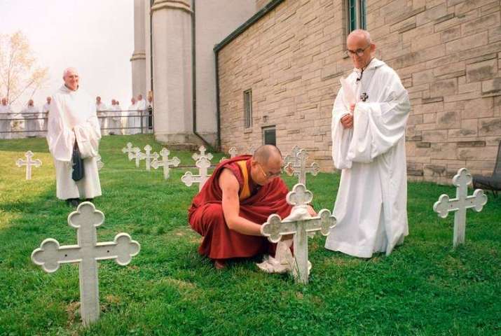The Dalai Lama at Thomas Merton’s grave in 1994. From newyorker.com