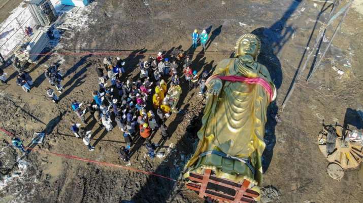 A final blessing ceremony was conducted before raising the Amitabha statue into place. From facebook.com