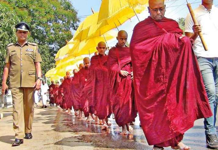 Buddhist monks take part in a Pindapatha at Anamaduwa as part of the week-long festivities. From sundaytimes.lk