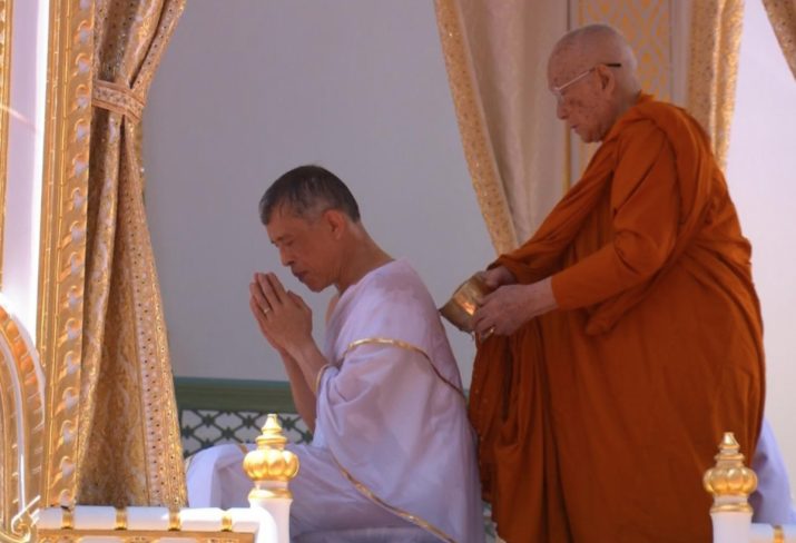 Thailand’s King Maha Vajiralongkorn undergoes a purification ritual before being crowned. From reuters.com