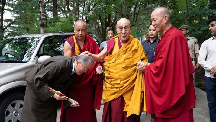 His Holiness the Dalai Lama is greeted by former Kalön Tripa, Tenzin Namgyal Tethong, as he makes his way from his residence to the main temple in the Tsuglakhang complex. Photo by Tenzin Choejor. From dalailama.com