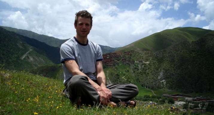 Alexander Gardner in front of Dzongsar Monastery, 2004. Image courtesy of Alexander Gardner