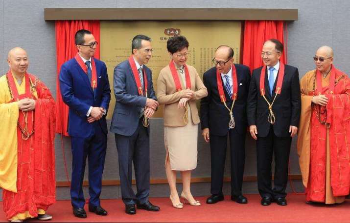 HKSAR chief executive Carrie Lam with Li Ka-shing and his sons, Tsz Shan monastic leaders, and Wang Zhimin, director of the liaison office of the PRC in Hong Kong. From chinadaily.cn