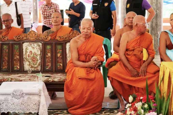 Phra Khru Sangkharakwinai Inthawinyo, seated right, the abbot of Wat Intharam in Kanchanaburi, has been accused of sexually abusing a 13-year-old novice monk. From chiangraitimes.com
