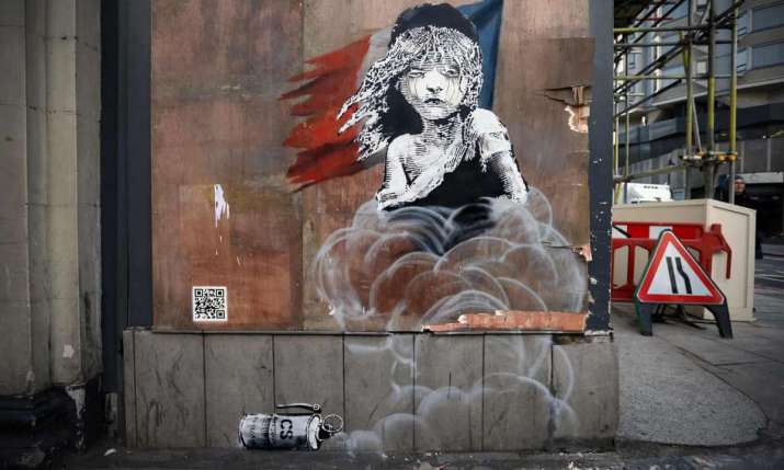 The <i>Les Misérables</i> artwork by street artist and political activist Banksy opposite the French embassy in London criticizes the use of tear gas to clear the Calais refugee camp in 2016. From theguardian.com