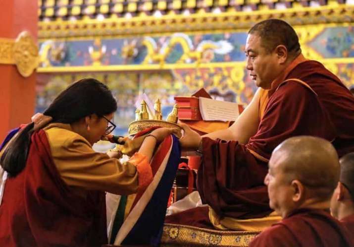 Khandro Tashi Chotso offering a mandala to His Holiness Shechen Rabjam Rinpoche. From Dilgo Khyentse Fellowship - Shechen Facebook