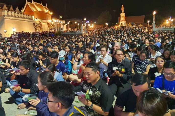 Thousands light candles and pray for those killed in the shooting rampage. Photo by Prasit Tangprasert. From bangkokpost.com