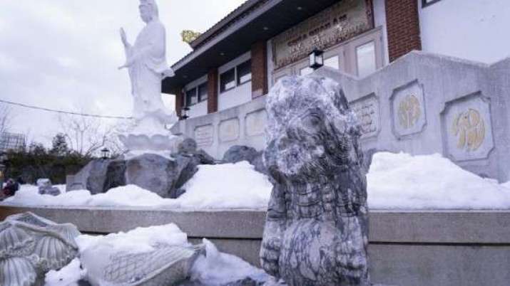 Vandalized statues outside of the Chua Quan Am temple in Montreal. From rcinet.ca.