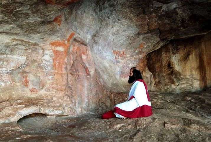 Prabodha Jnana meditating in a natural cave in a cliff face of the Badami Hills, Karnataka. The remains of a carvings of the Buddha and the bodhisattva Padmapani (Avalokiteshvara) can be seen on the wall. Image courtesy of Prabodha Jnana and Abhaya Devi