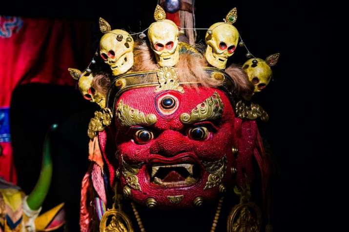 Ceremonial <i>tsam</i> mask of Begtse, the pre-Buddhist Mongolian god of war. The red mask, decorated with beads, represents power and strength. From the Milan Klečka collection. Photo by Jakub Šedý. Image courtesy of the Náprstek Museum