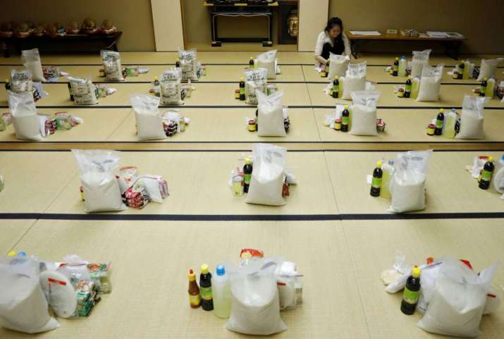 A Vietnamese worker who lost her job because of the COVID-19 pandemic prepares welfare packages for Vietnamese people in Japan. From japantimes.co.jp