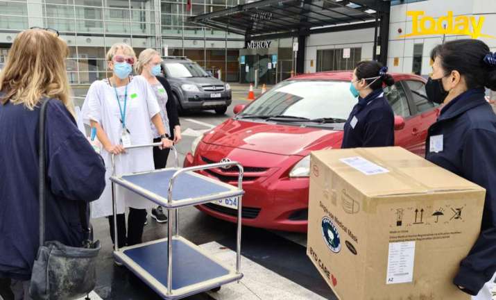 Grateful healthcare workers receive a delivery of essential PPE supplies from Tzu Chi Australia. From 9now.nine.com.au