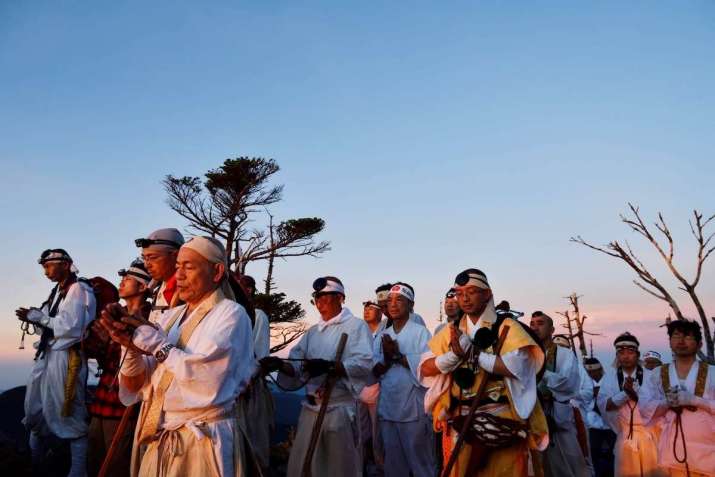 Prayer in the mountains is part of mountain entry practices, shown here by a group of Shugenja from Yoshino. Photo by Banri Tanaka
