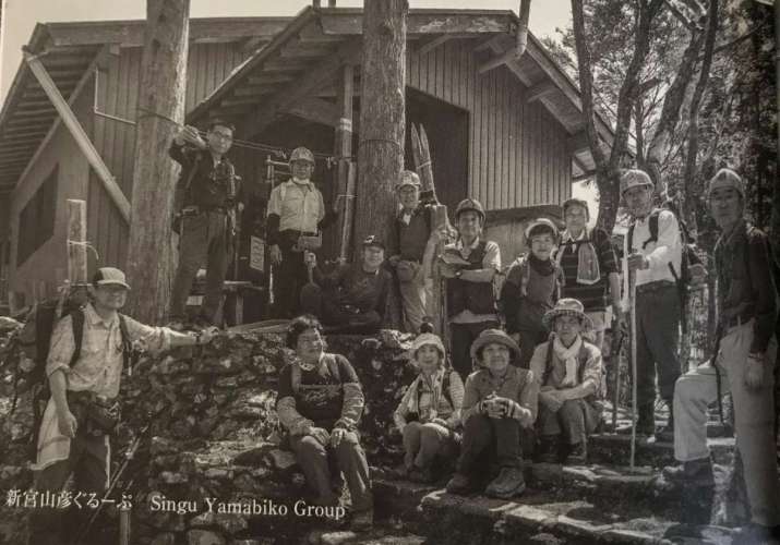 Members of Shingu Yamabiko in front of a mountain hut they built along the Okugakemichi. Photo by Takeshi Mori
