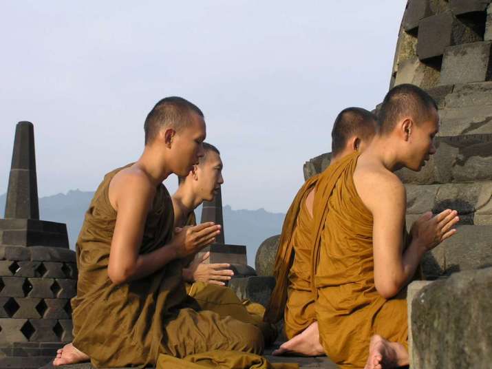 Buddhist monks meditate on the top platform of Borobudur. From wikipedia.org